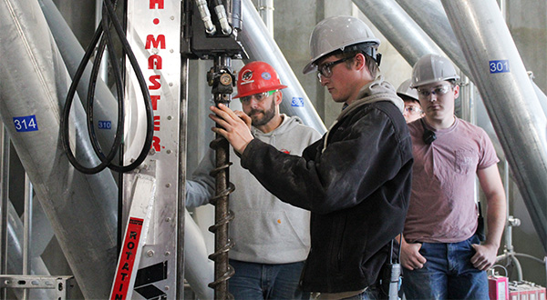 Student working on Feed Mill Equipment